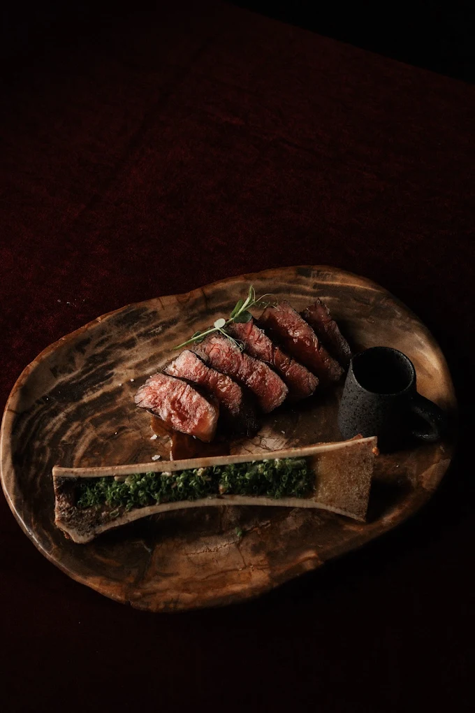 Wagyu striploin plated on hand-carved wooden board